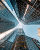 Looking directly up at the skyline of the financial district in central City of London, UK – creative stock image