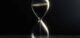 Hourglass on dark background