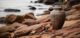 a cremation urn on a rocky beach