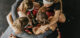 Hockey players huddling while crouching on floor in health club