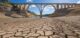 drought in spanish reservoir with viaduct